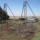 These are average manually cranked A-frame jacks. The sturdiest kind has a metal plate filling part of the upper frame . . . but these require 3 men to move each jack.