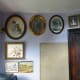 Pictures and painting rehung around the office door and notice board
