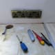 Turning off the power, unscrewing the wall sockets, and nipping up to 1/2 inch wallpaper behind the socket; for a neat finish