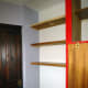 The pine table top cut to size for shelving, and fitted in place