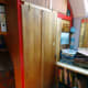 Completed wardrobe in office, with folding door shut