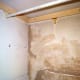 Plaster repair done on the brick wall