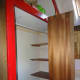 The large shelving around the corner, behind the clothes rail, to be removed as it was not very accessible