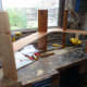 Gluing the supports to the middle shelf at the joints