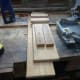 The six pieces of timber I cut from scrap wood to make the cable management trough. The two big pieces being recycled from the old corner unit
