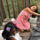 Playing outdoors with my doggie and friend is fun