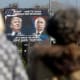 “A billboard showing a pictures of then-president elect Donald Trump and Russian President Vladimir Putin is seen through pedestrians in Danilovgrad, Montenegro, November 16, 2016.”