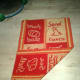 Fold one corner of the towel all the way to the middle of the long edge of the towel (here, the lower right hand corner to the left edge).