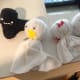 Little ghosts made with scrap fabric, stuffing, puff paint, and googly eyes.