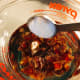 In a pitcher, combine dates, baking soda, and boiling water. Set aside and let it sit for 15 minutes.