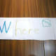 Hands-on spelling. The answer to Where? is inside the word -- here!