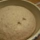Dough has risen sufficiently when indents remain.