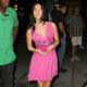 Megan Fox in a short pink dress and high heels
