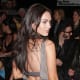 Megan Fox in a short gray dress and high heels