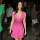 Megan Fox in a short pink dress and high heels