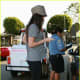 Megan Fox in leggings and funky high heels getting a ticket