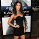 Megan Fox in a short black dress and high heels