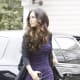 Megan Fox in a tight purple dress and strappy high heels