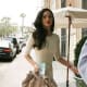 Megan Fox in a little white dress and high heels preparing to promote Jennifer's Body