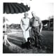Date of April, 1958. George and Minn Hibbard with their dog, Blackie, in McAllen, Texas while on vacation.