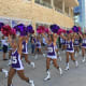 2016 Showgirls marching around the stadium. Pink poms for Cure All Cancer