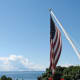 Geraniums & U.S. flag on the porch