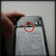 On the LG Rumor Touch there is a small cutout for using your fingernail to remove the battery. Most phones will have some sort of notch to all you to slip a fingernail or a small object to remove the battery.