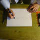 Fill in letters around the message with a friction pen to disguise the secret message.