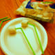 Insert large marshmallows into green straws to create the alien's eyes.