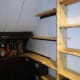 New shelving butted against original shelves.