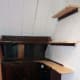 Ends of the two wall shelf supports shortened and levelled with each other using the SoniCrafter with the shelf supports still fixed to the wall in preparation to adjoin new shelving.
