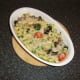 Parmesan cheese is melted over the top of the pasta and vegetables
