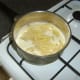 Pasta is added to the cheese sauce