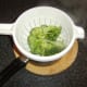 Cooked broccoli is thoroughly drained