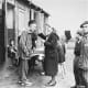 German Red Cross worker helps a survivor.