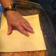 Put a thick layer of sauce on the bottom of the pan, then begin to place the lasagna sheets in a single layer. Ensure you overlap your lasagna sheets!