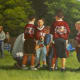 Oil Painting of my grandson's Flag Football Team huddle.
