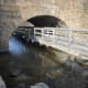 As we approach Bride Brook, there is a boardwalk/bridge over the brook. We cross back under the RR bridge.
