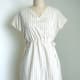 If you're brave and good with a sewing machine, try making your own vintage reproduction dresses using vintage patterns and fabrics like this one.