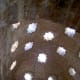 Alhambra: bath house, ceiling: Star openings in the ceiling and upper wall.