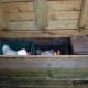Lid made from decking, opens to store plastic recycle bins inside.