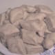 Raw dumplings ready to drop into the boiling soup mix.