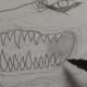 Going over the teeth with an ink pen.