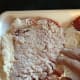 Using the flour around the sides, coat the entire top of the cube steak.