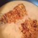 After the gravy has been combined, add the steaks back in and flip them over to coat them in the gravy.