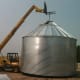 Unfortunately, the boom extended only about 35 feet, which was not enough to finish building these 6-ring bins. Here there are only four rings. The wind came up so we quit for the day.
