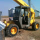 The forklift is parked downwind, so if the bin does slide, it is still partially contained.