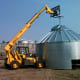 The bin is lifted repeatedly, and sometimes must be moved from place to place for safety during off-hours. The truck in the background is helping block wind.