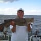 Gone Fishin Club Member Stacy with a small Flathead Catfish