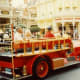 Red firetruck offering transportation in Main Street USA
